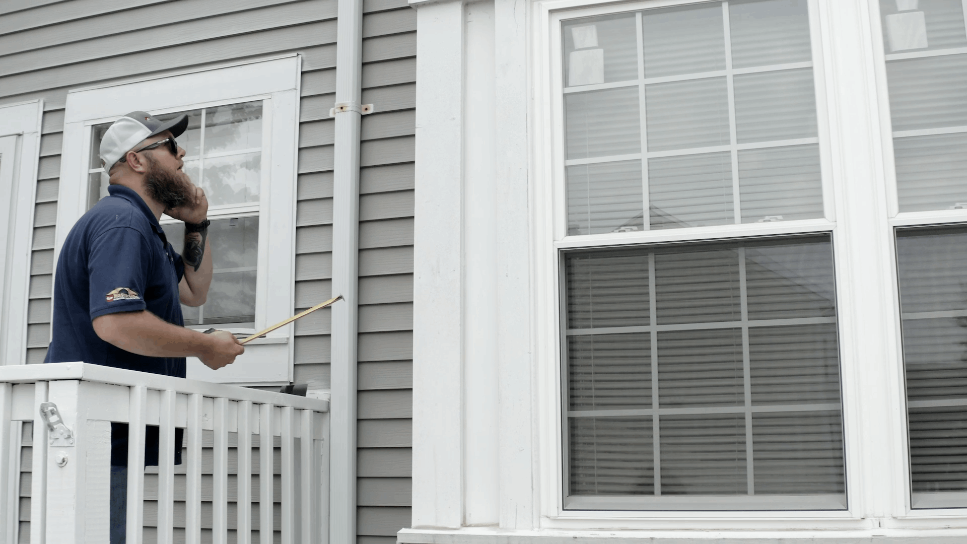 Expert window installer inspecting a new window