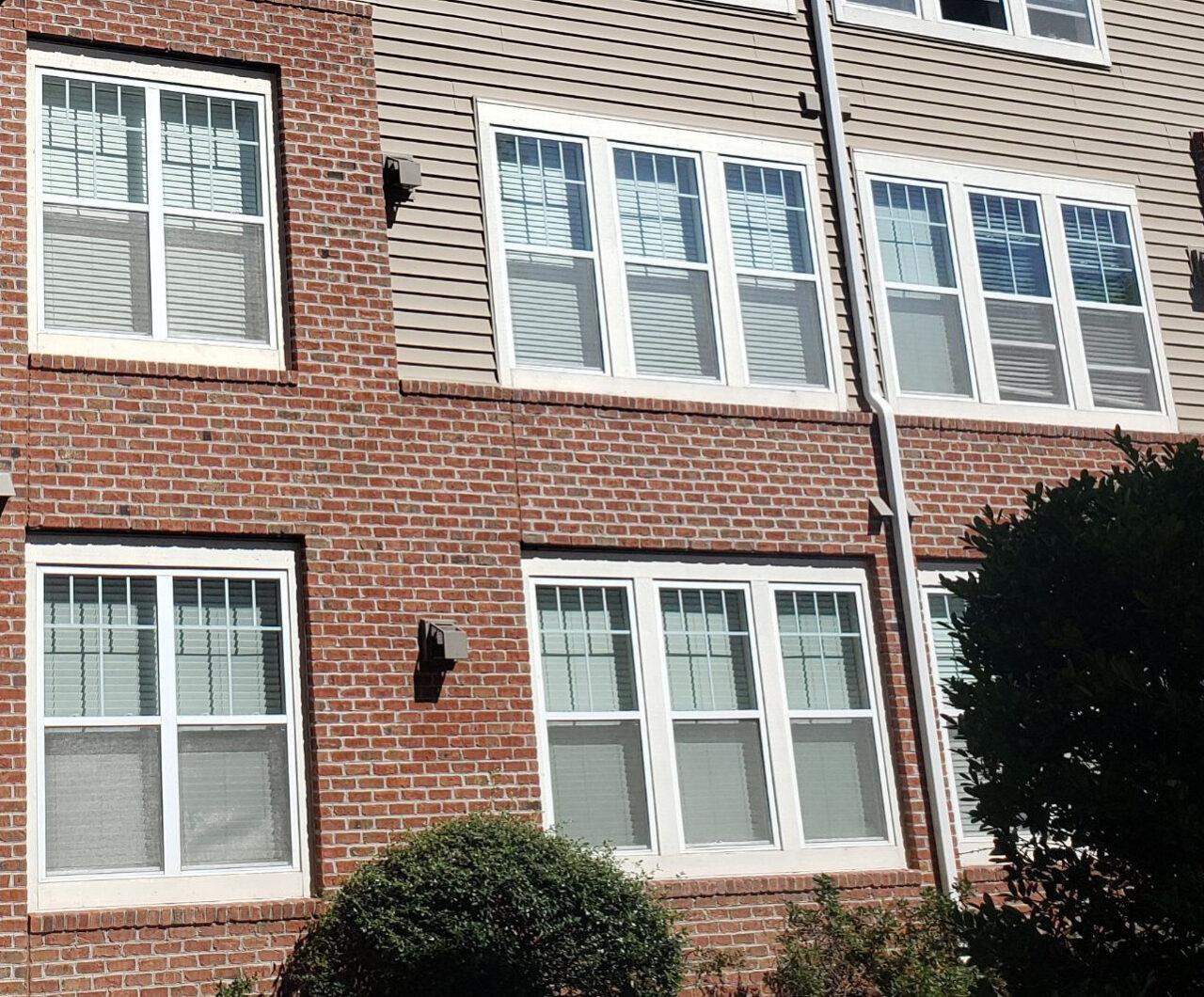 Multiple windows on the side of a building in Newington