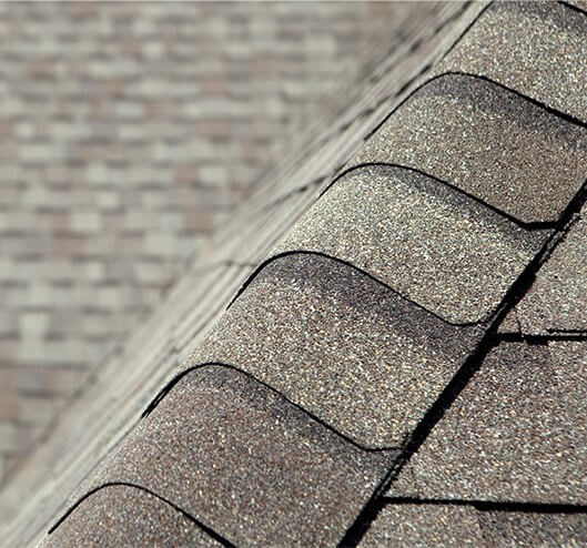 checking shingles during roof inspection in Springfield, VA