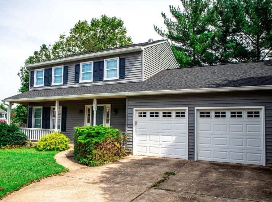home with new asphalt roofing in Maryland